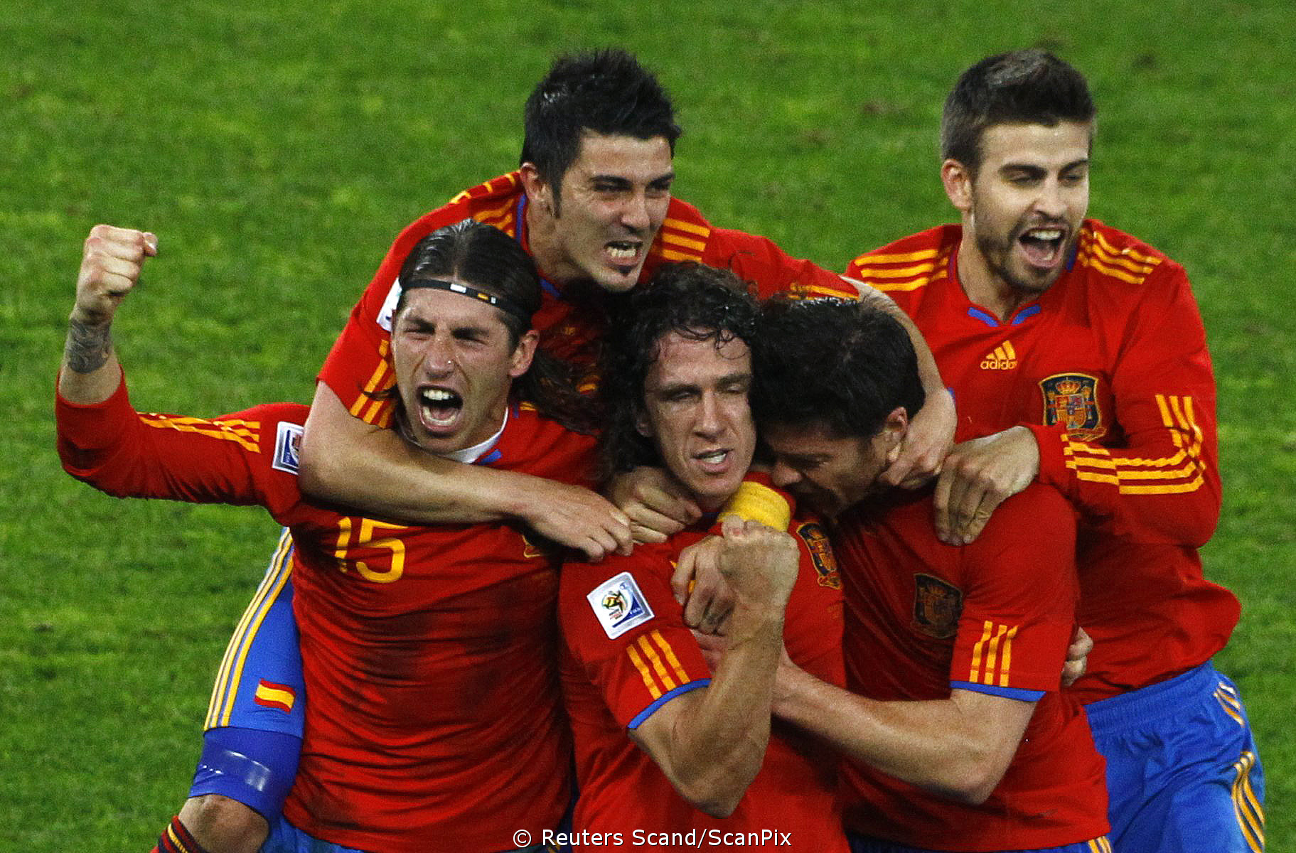 Spain’s Carles Puyol (C) celebrates with team mates after sc