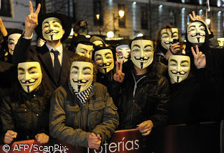 Members of an anonymous group protest during Spain’s film Goya Awards ceremony at Teatro Real in Madrid